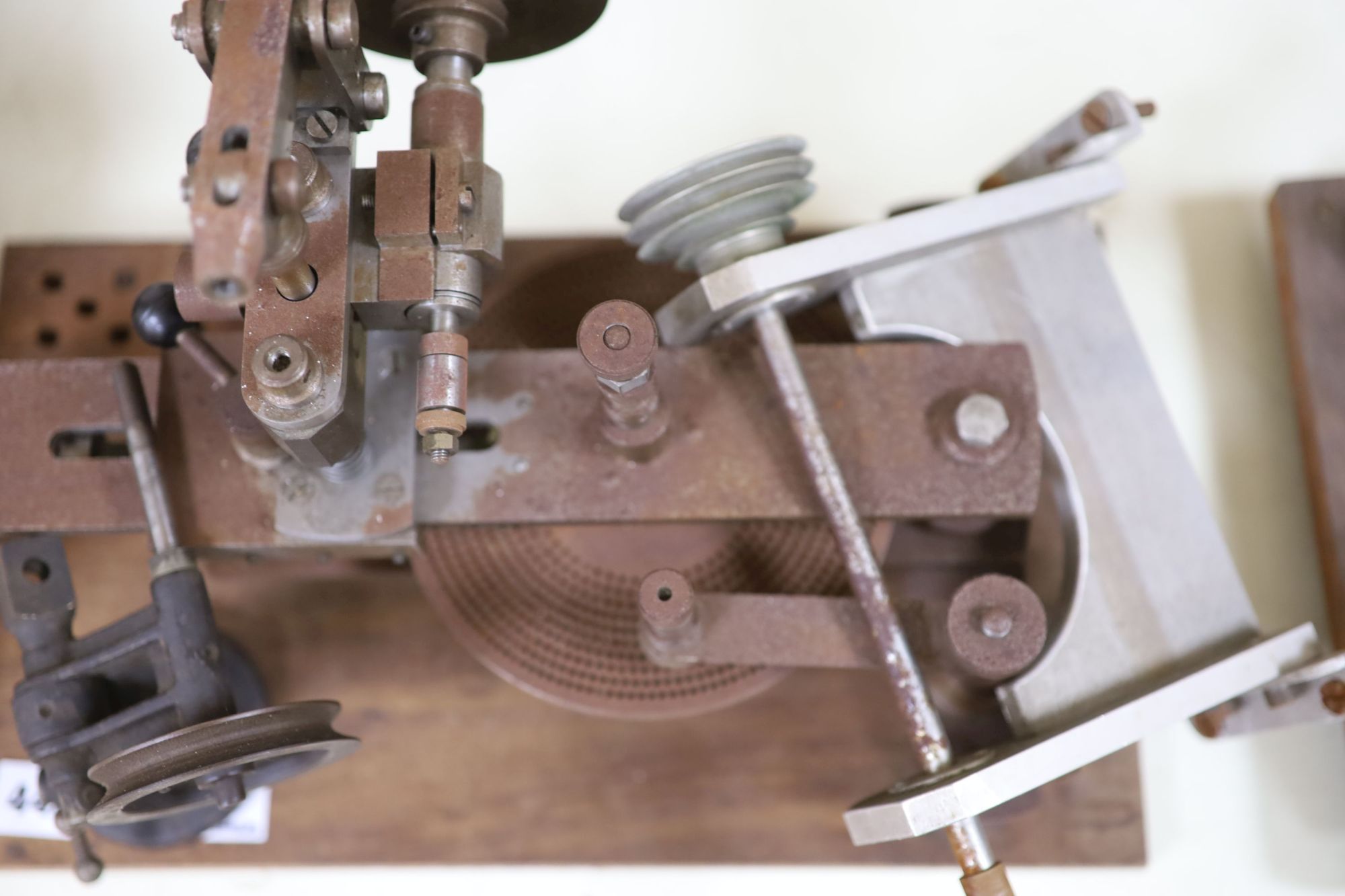 Watch & Clockmakers tools - a steel bushing? tool, wood plinth, 39.5cm and other various accessories